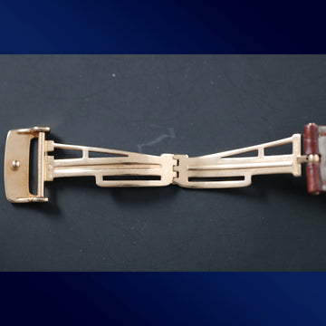 Audemars Piguet 18K gold deployment buckle clasp with brown alligator strap