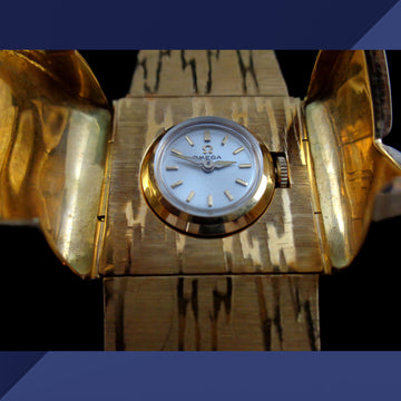 Beautiful Omega Secret watch in 18K solid yellow gold from 1960 with manual wind movement