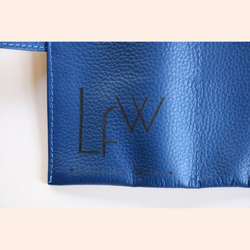 A High end handcrafted leather watch pouch in blue grain leather with LFW logo