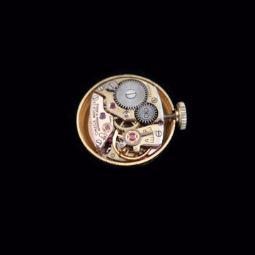 Beautiful Omega Secret watch in 18K solid yellow gold from 1960 with manual wind movement