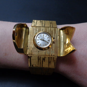 Beautiful Omega Secret watch in 18K solid yellow gold from 1960 with manual wind movement